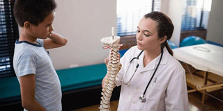 Child with chiropractic getting adjusted for healthier living