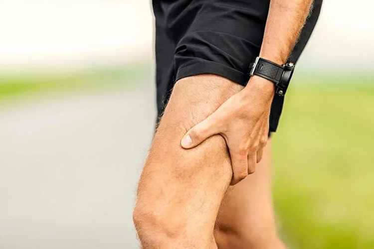 Man experiencing sciatic pain in his leg seeking chiropractic care for relief